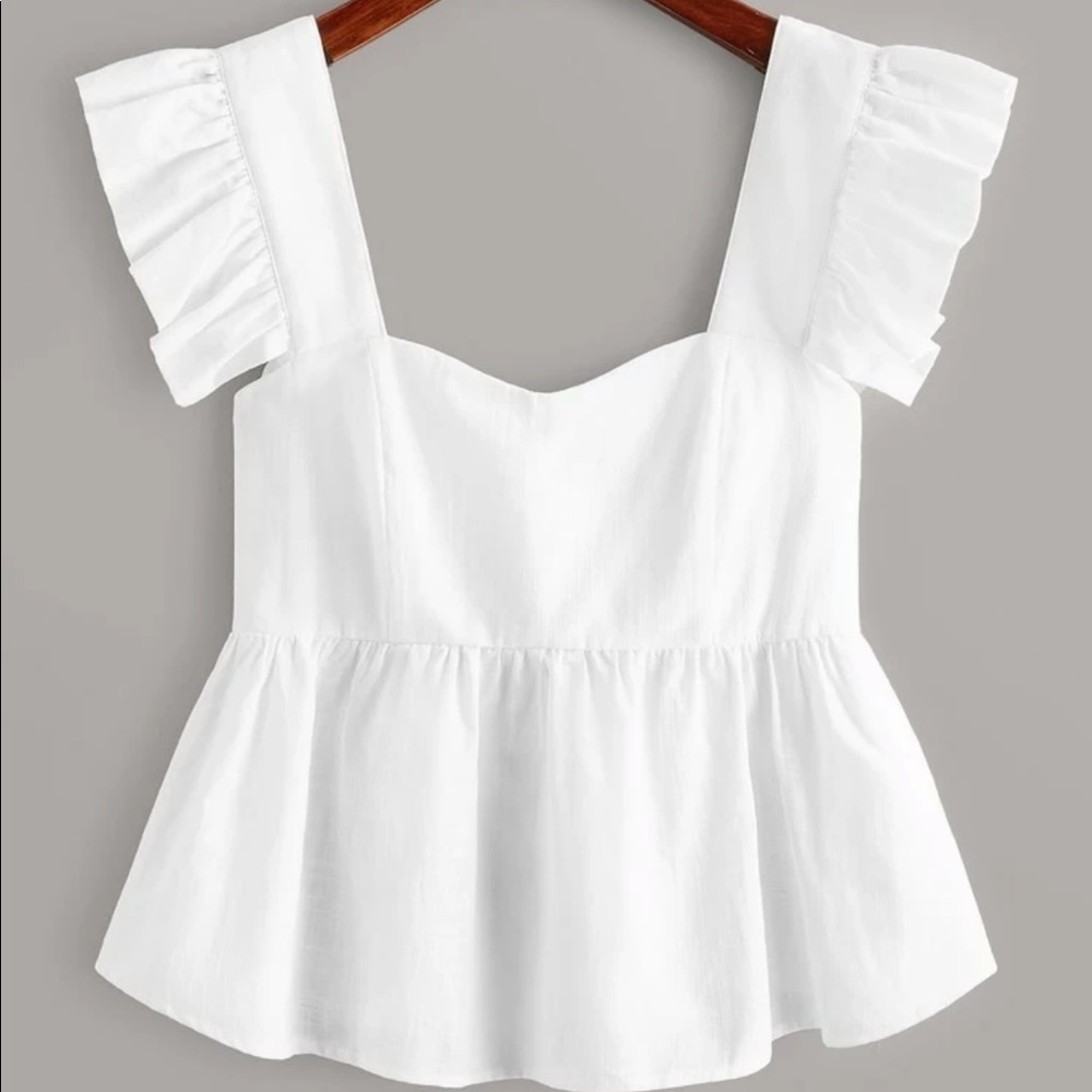 white ruffle shirt